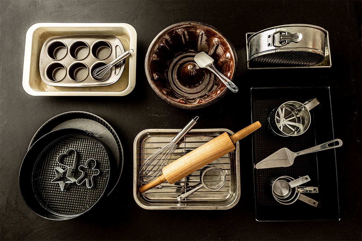 A selection of different bakeware on a countertop (colour pans)