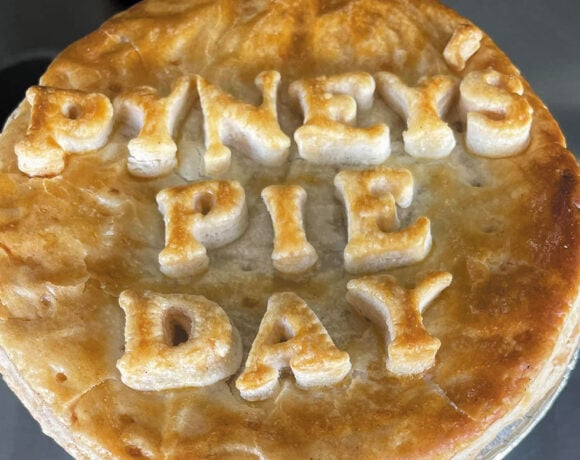 A pie with the words "Pyney's Pie Day" baked into the top