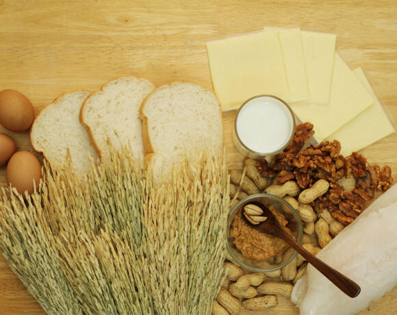 A wooden benchtop with various bread ingredients on it (PBCo)