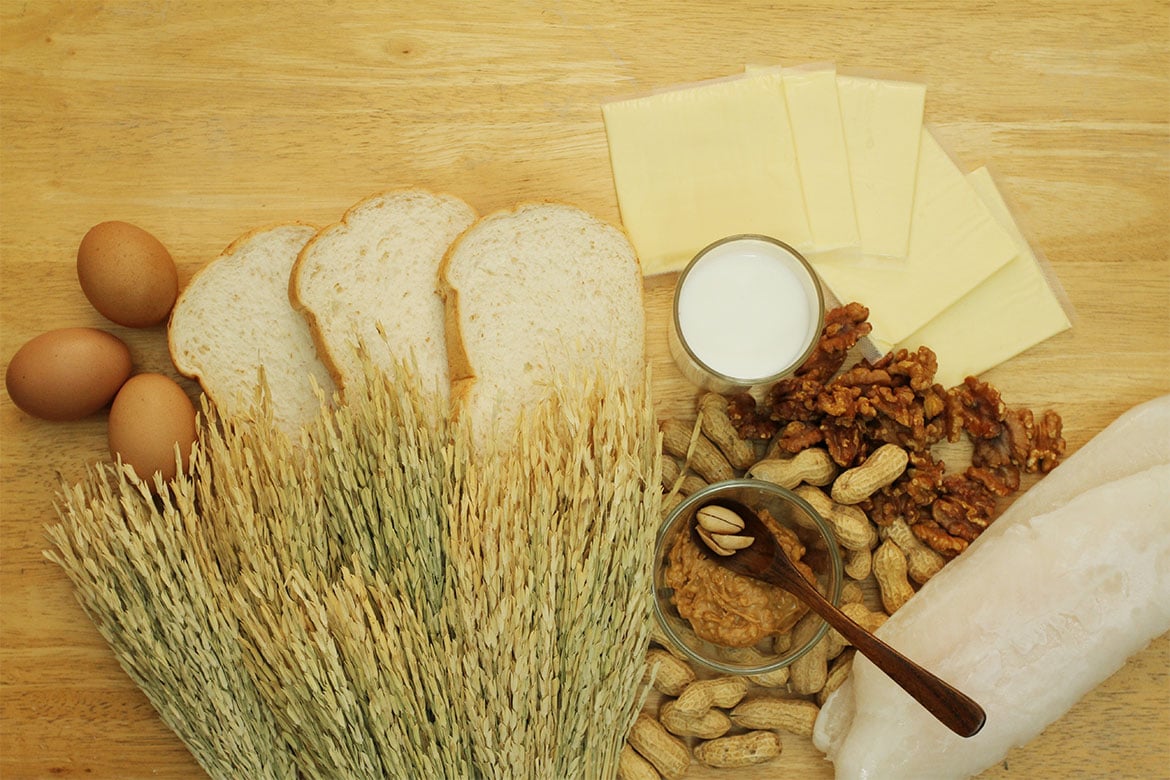 A wooden benchtop with various bread ingredients on it (PBCo)