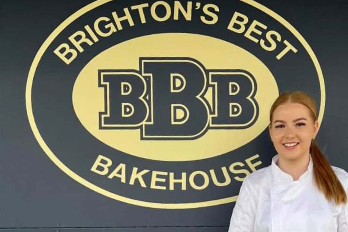 Sophie Weeding in front of the Brighton's Best Bakehouse sign (competition)