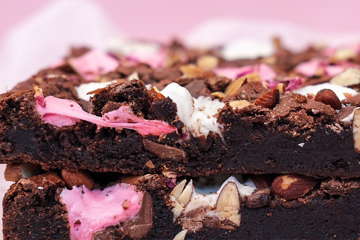 rocky road brownies; pink tissue paper in the background (Vegas & Rose)