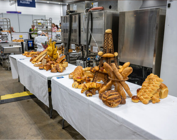 competition tables with bread stacked on them, in the foreground, the bread rolls are arranged in the shape of the Eiffel Tower (WorldSkills)