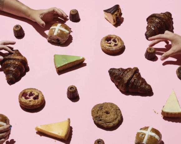 Baker's Dozen features Melbourne's best bakers. Image is numerous baked goods spread across a pink background with hands reaching in to grab them