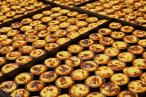 Trays full of Portuguese custard tarts