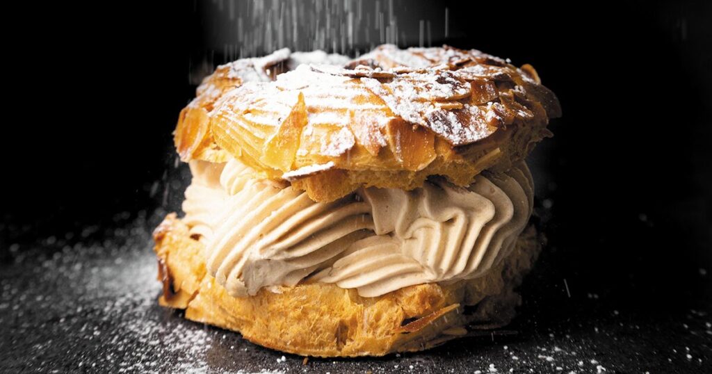 Layered pastry with cream filling and icing sugar on top