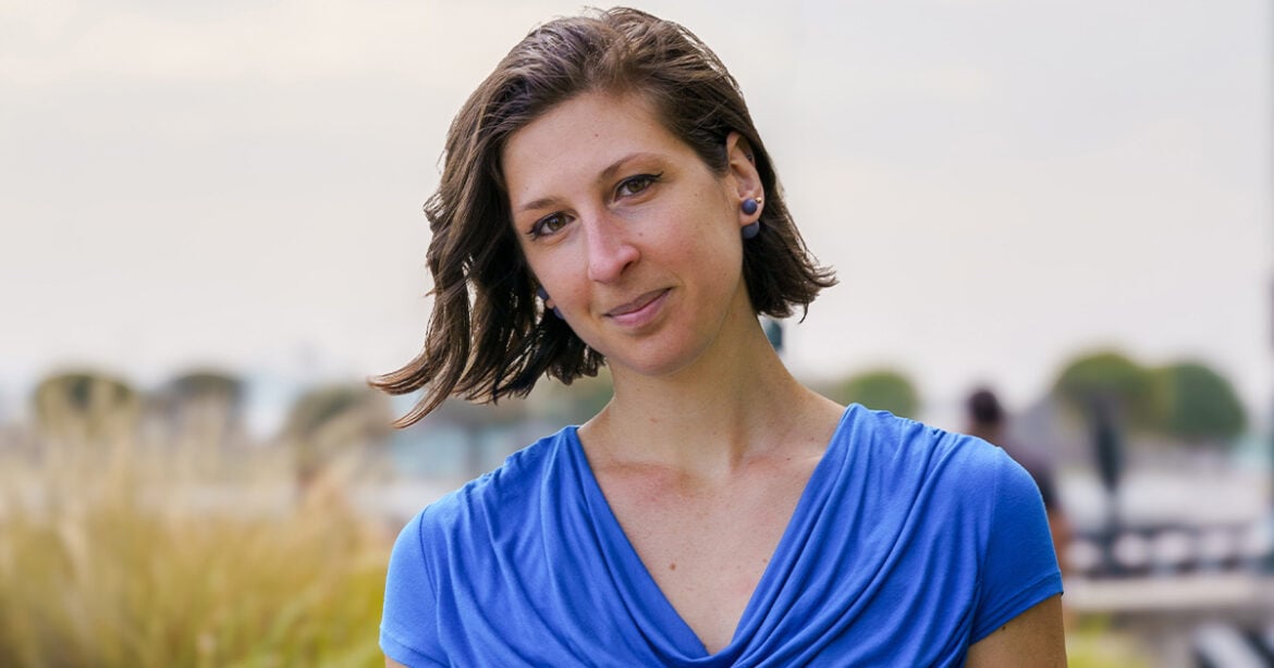 Noted Chef creator Valentina Ricchi smiles at the camera. She has dark hair and is wearing a blue shirt.