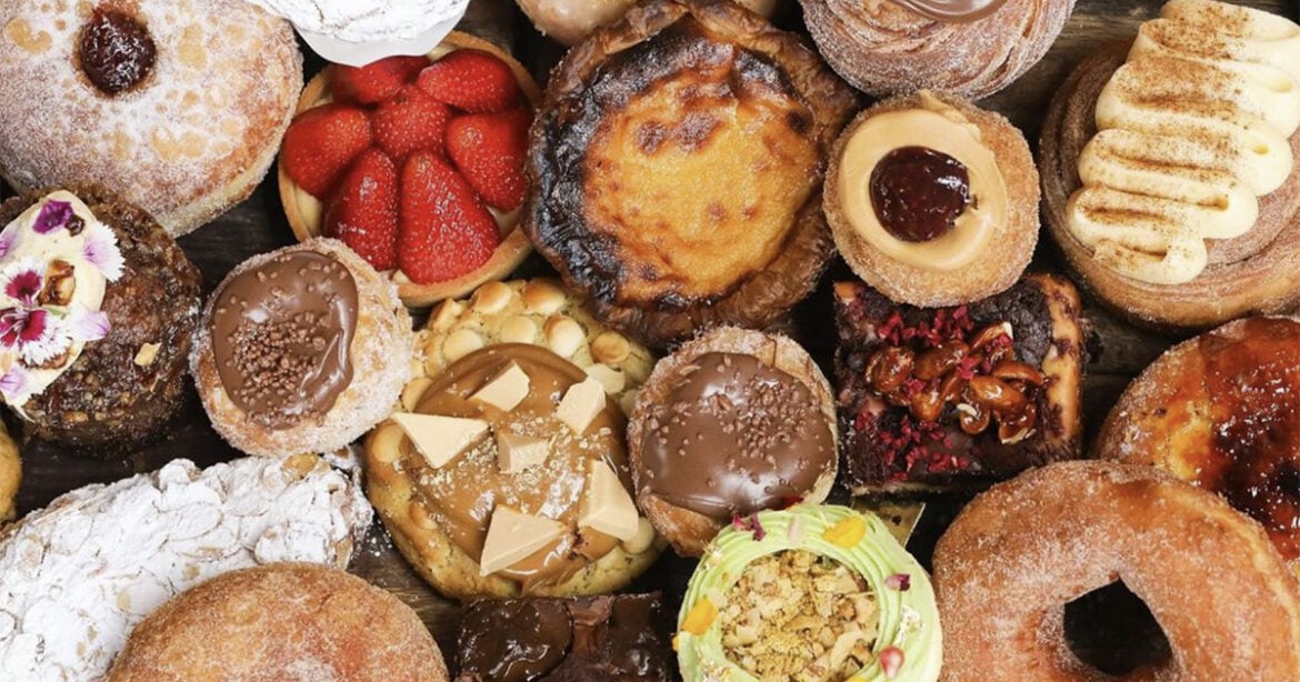 Paddock Bakery has announced a new store opening in Geelong, Victoria. Pictured is a platter full of baked pastries and cakes.