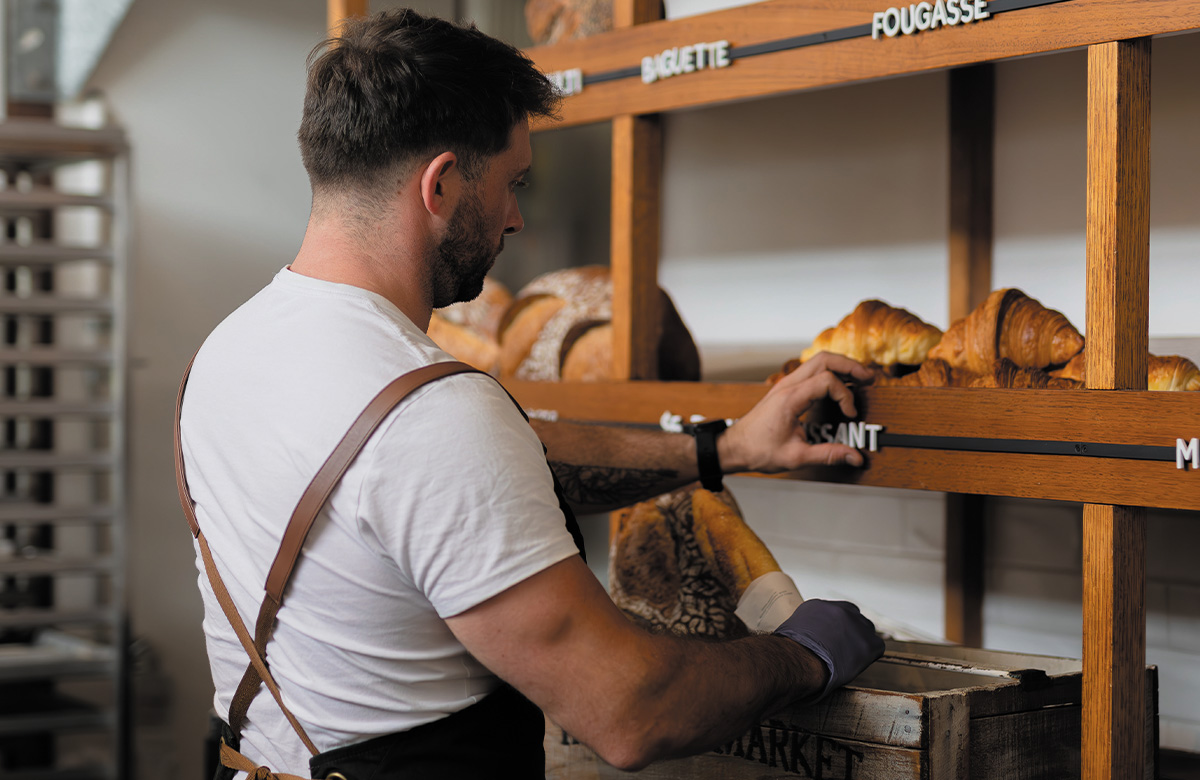 The shelves are being stocked at Franquette Bakery. 