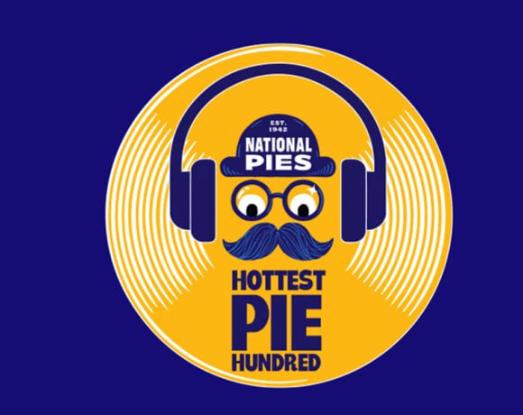 Voting is open for National Pie's Hottest Pie Hundred. Pictured is a yellow pie graphic with a face in blue on the top. The face is wearing headphones. Underneath it says Hottest Pie Hundred.