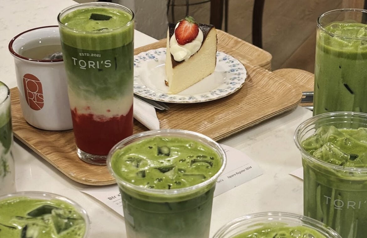 Tori's second outpost will focus on beverages like Matcha. Picurted is a counter with five plastic cups filled with green matcha