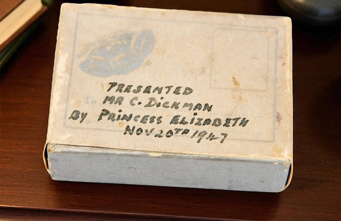 The slice of cake set to be auctioned off is still in its original packaging