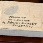 The slice of cake set to be auctioned off is still in its original packaging