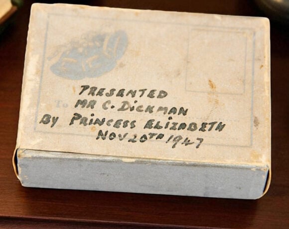 The slice of cake set to be auctioned off is still in its original packaging