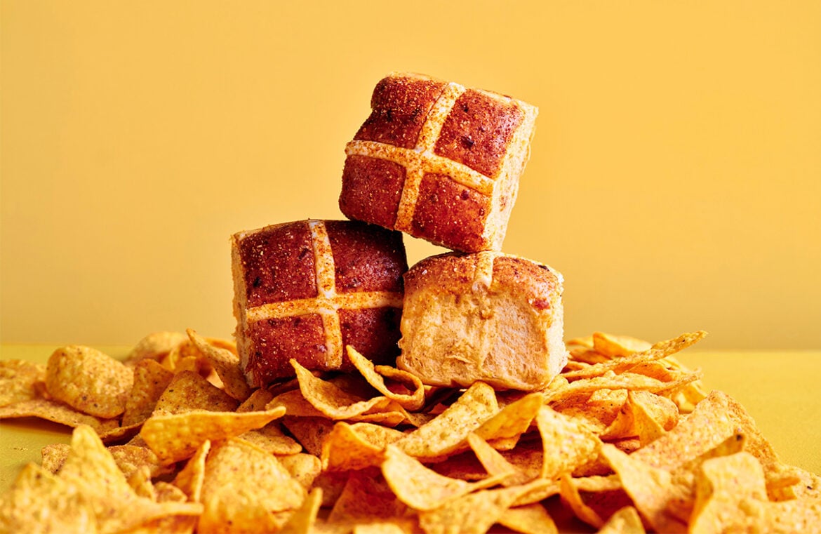 The hot cross bun collaboration includes a savoury cheesy jalapeno variety with Doritos