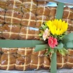 CJ's Bakery will be hosting an auction to raise money for Endometriosis Australia. Pictured is a box of hot cross buns with flowers on top
