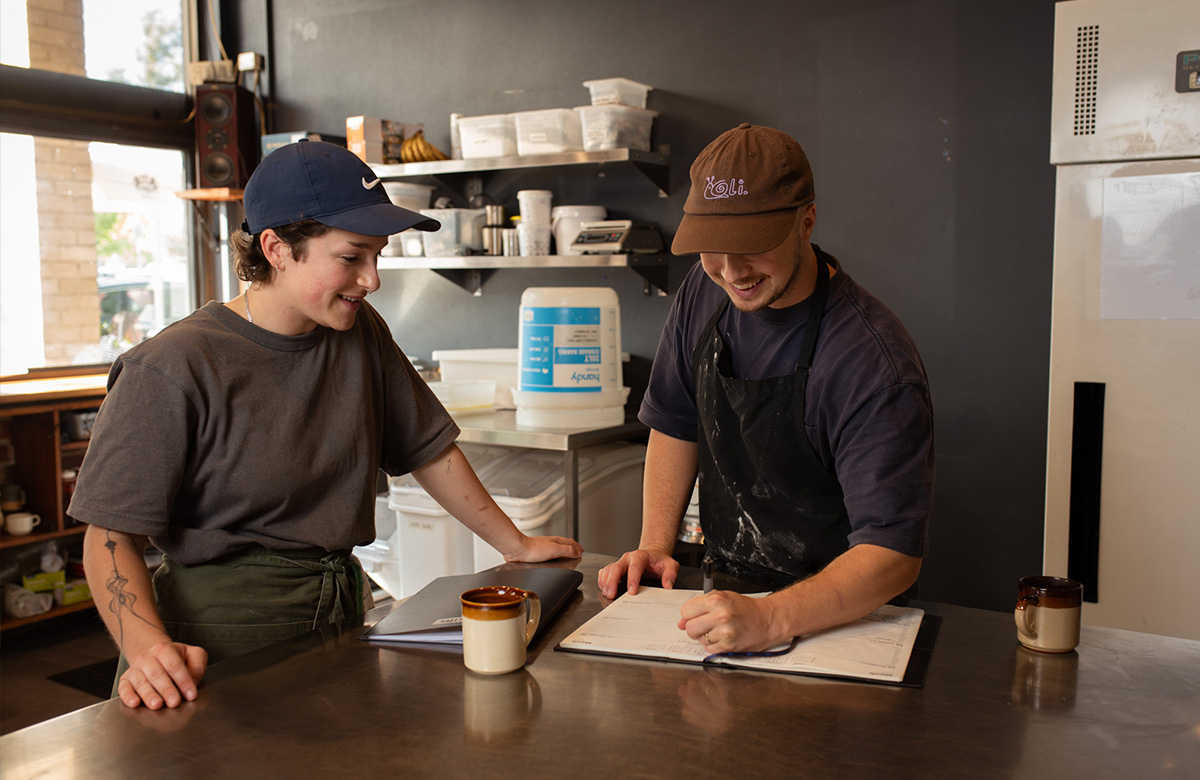 Lachlan with an Under Bakery staff member