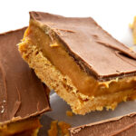 Caramel Slice has been an Australian bakery favourite for decades. Pictured is two pieces of caramel slice, stacked on each other.
