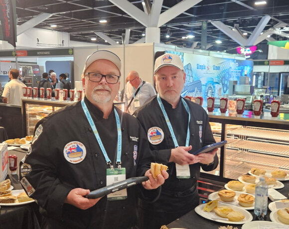 Stephen Pinnuck (left) judging at the Official Great Aussie Pie Competition