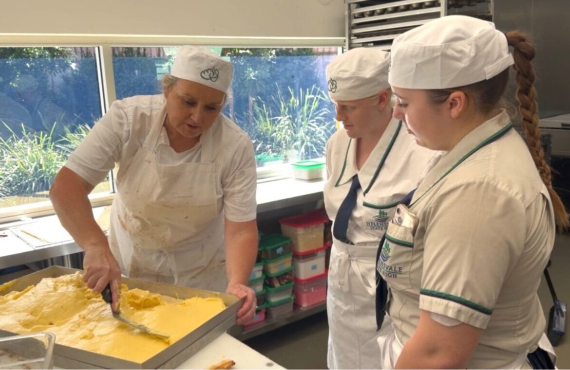 Students taking part in Banjo's Bakery Self Raising Program watch on in the kitchen