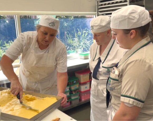 Students taking part in Banjo's Bakery Self Raising Program watch on in the kitchen