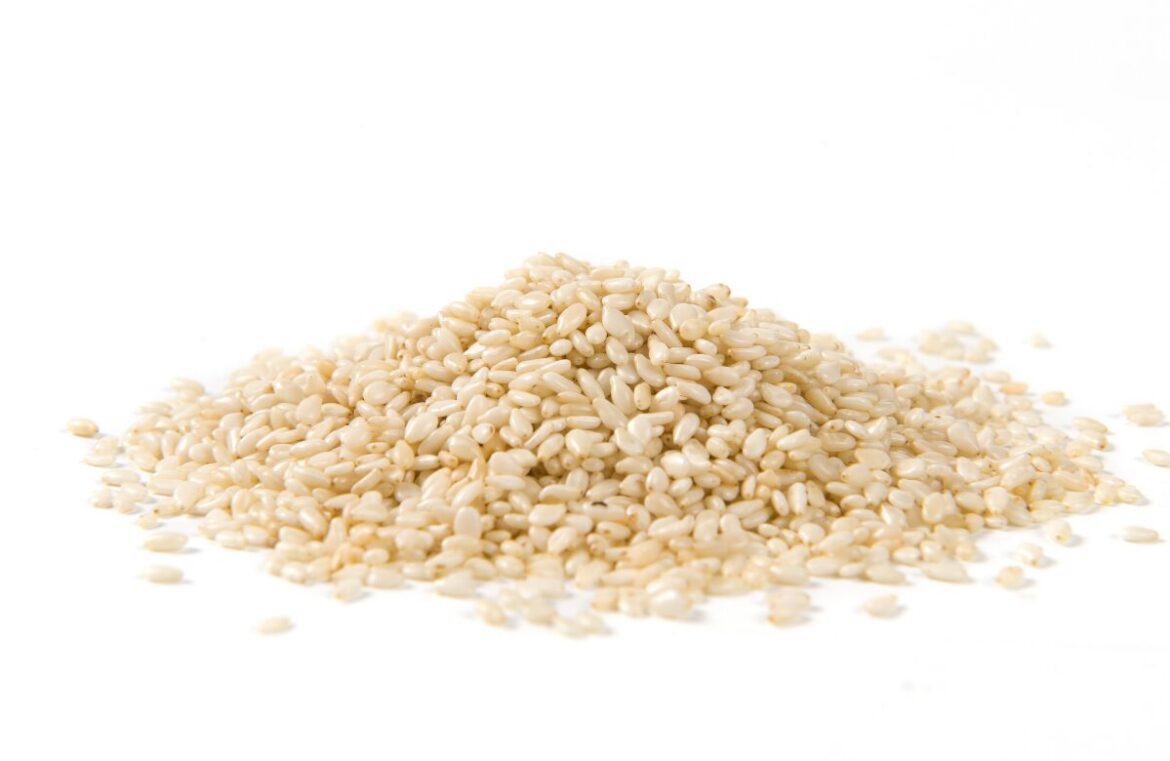 Trials are underway that could see a sesame industry be established in Australia. Pictured is a mound of white sesames seeds on a white background.
