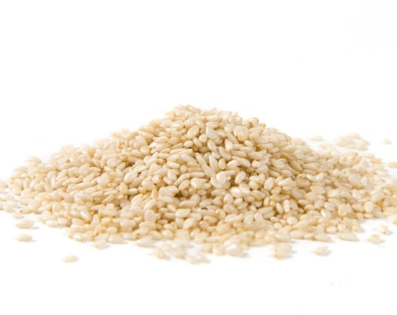 Trials are underway that could see a sesame industry be established in Australia. Pictured is a mound of white sesames seeds on a white background.